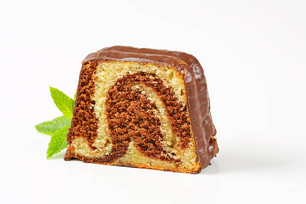 Slice of marble pound cake with chocolate glaze