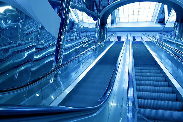 istock blue modern escalator in business center 466214811