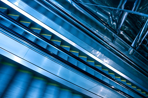 istock blue modern escalator in business center 466215487