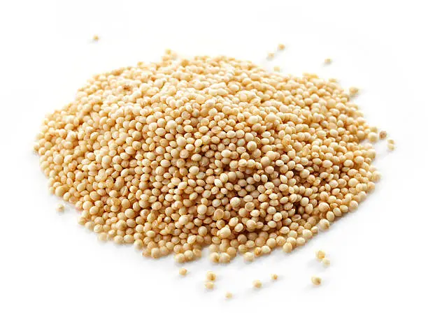 heap of amaranth seeds isolated on white