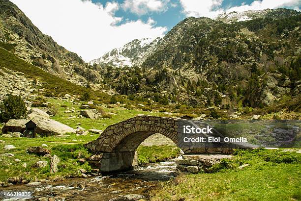 Snow Capped Mountains With River And Bridge Stock Photo - Download Image Now - Andorra, Cloud - Sky, Cloudscape
