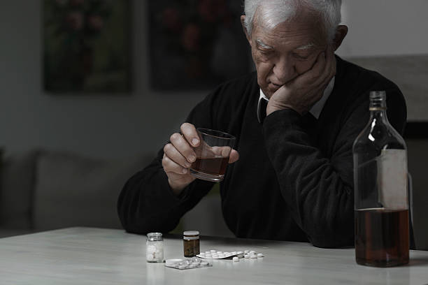Elderly man addicted Elderly man addicted to alcohol and drugs divorcee stock pictures, royalty-free photos & images