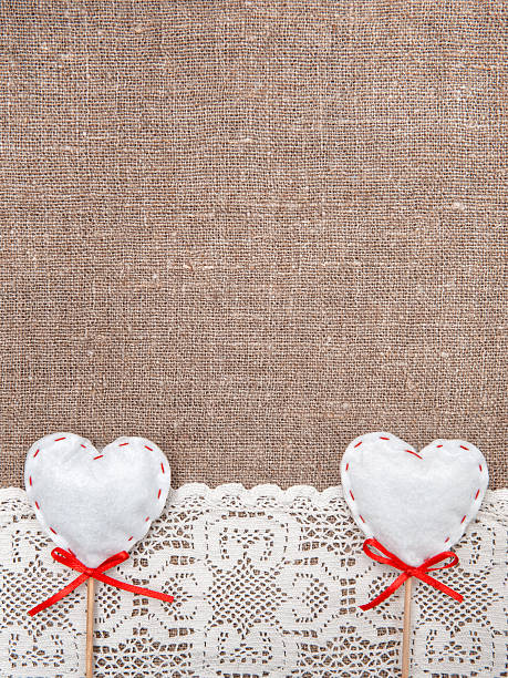 istock Textile hearts and lacy cloth on the burlap 466220699