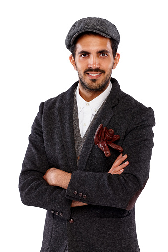 Portrait of young indian man in retro outfit smiling against white background