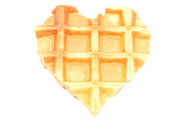 Closeup of heart shaped waffles. Isolated on white background
