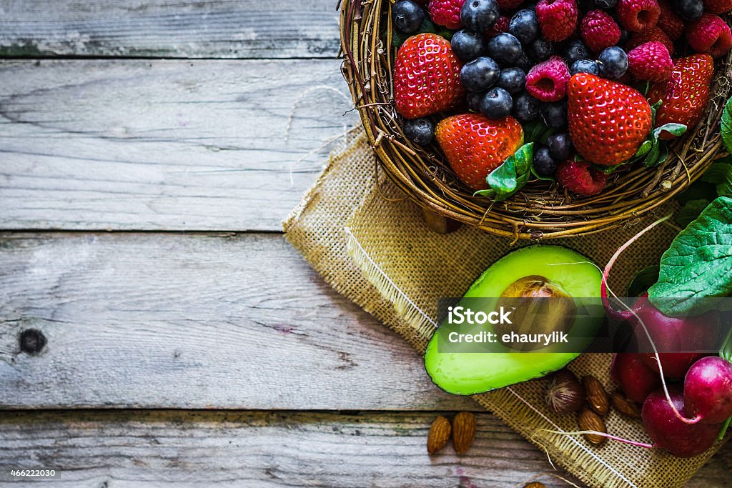 Fruits and vegetables on rustic background Fruits and vegetables on rustic backgroundFruits and vegetables on rustic background 2015 Stock Photo