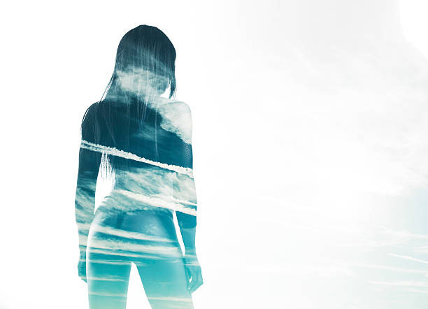 istock Double exposure of beautiful model back and cloudscape 466222278