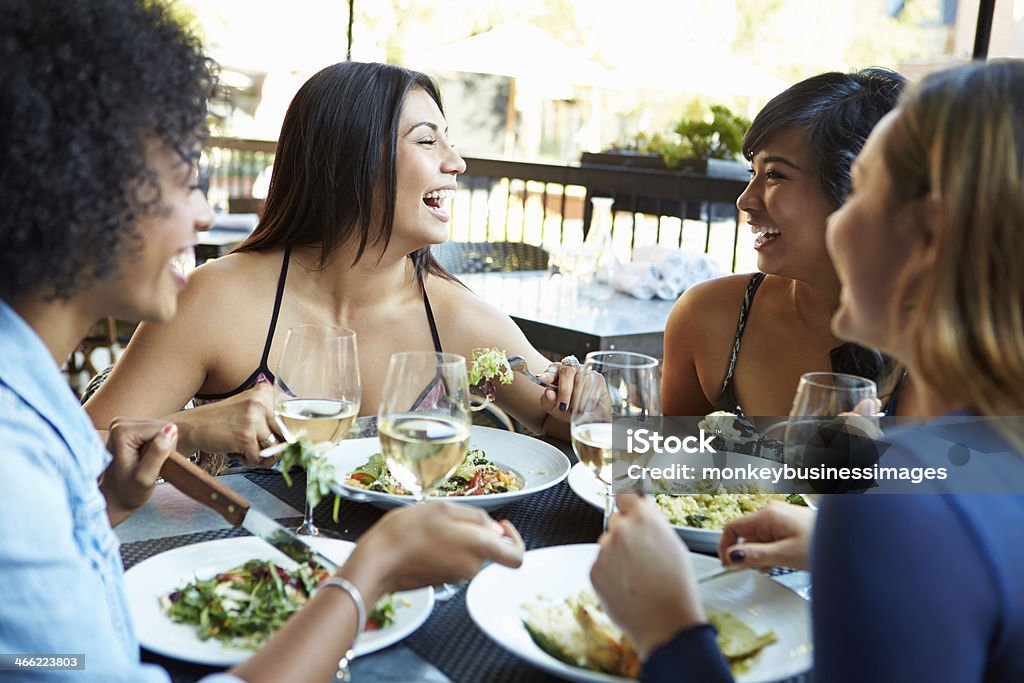 Group Of Female Friends Enjoying Meal At Outdoor Restaurant Happy Smiling Group Of Female Friends Enjoying Meal At Outdoor Restaurant Female Friendship Stock Photo