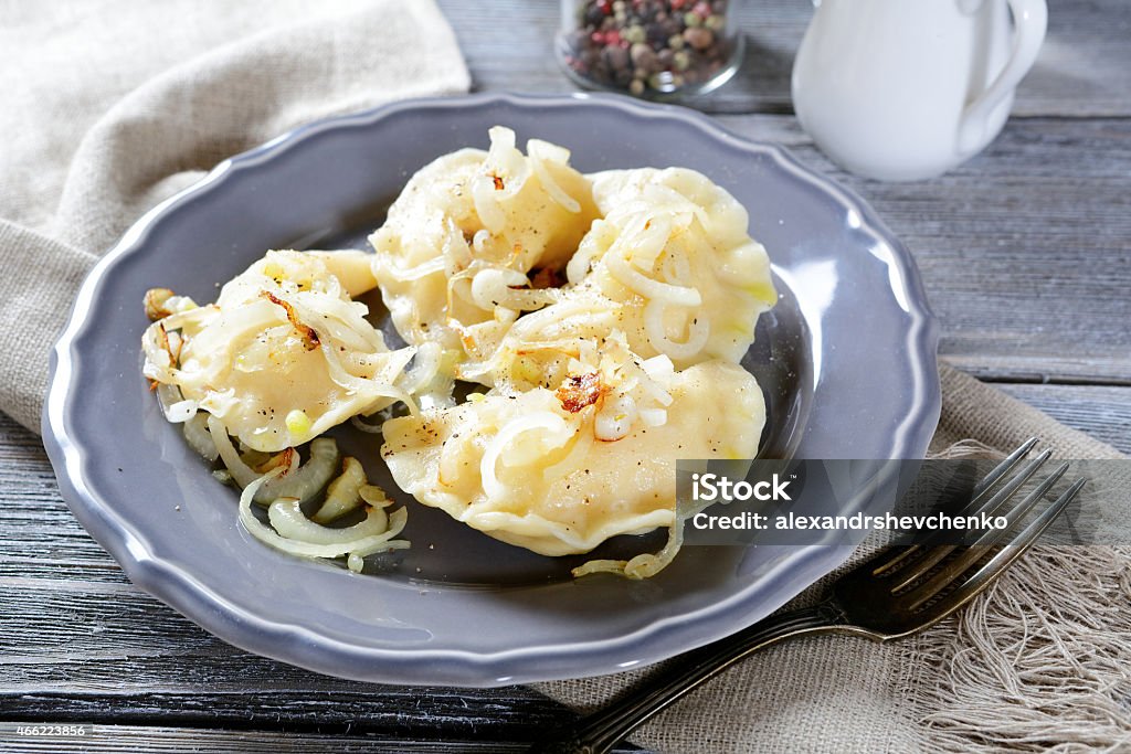 Pierogi with potatoes on a plate Pierogi with potatoes on a plate. Homemade food 2015 Stock Photo