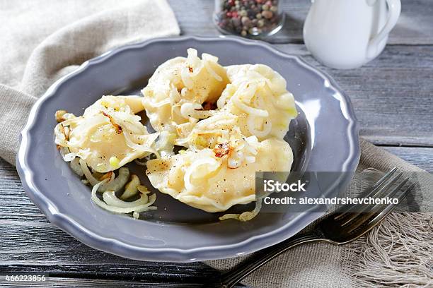 Pierogi With Potatoes On A Plate Stock Photo - Download Image Now - 2015, Backgrounds, Cooked