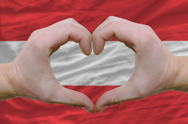 Heart and love gesture over flag of austria stock photo