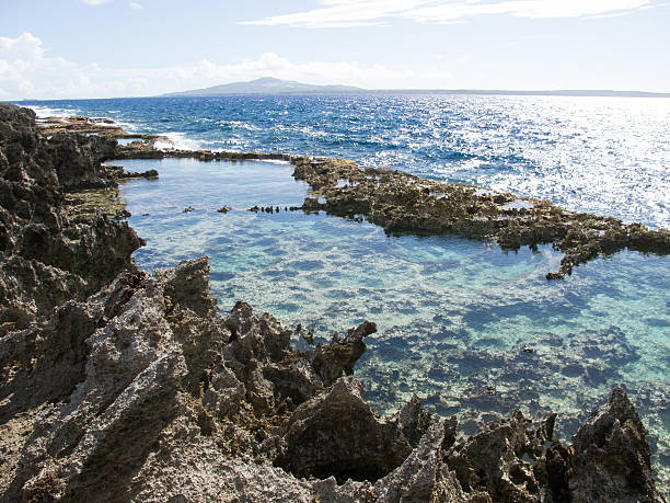istock Rocky tropical tide pool with blue ocean 466224363