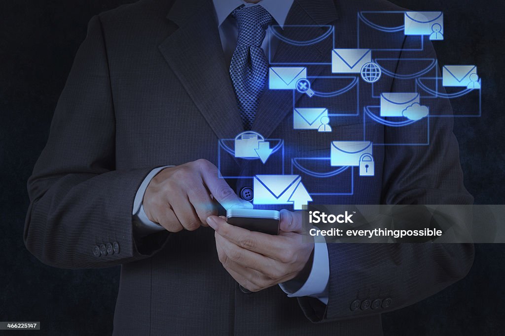 businessman hand use smart phone computer with email icon businessman hand use smart phone computer with modern email icon Adult Stock Photo