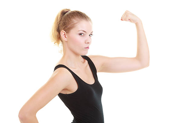 istock Fitness woman showing energy flexing biceps 466225257
