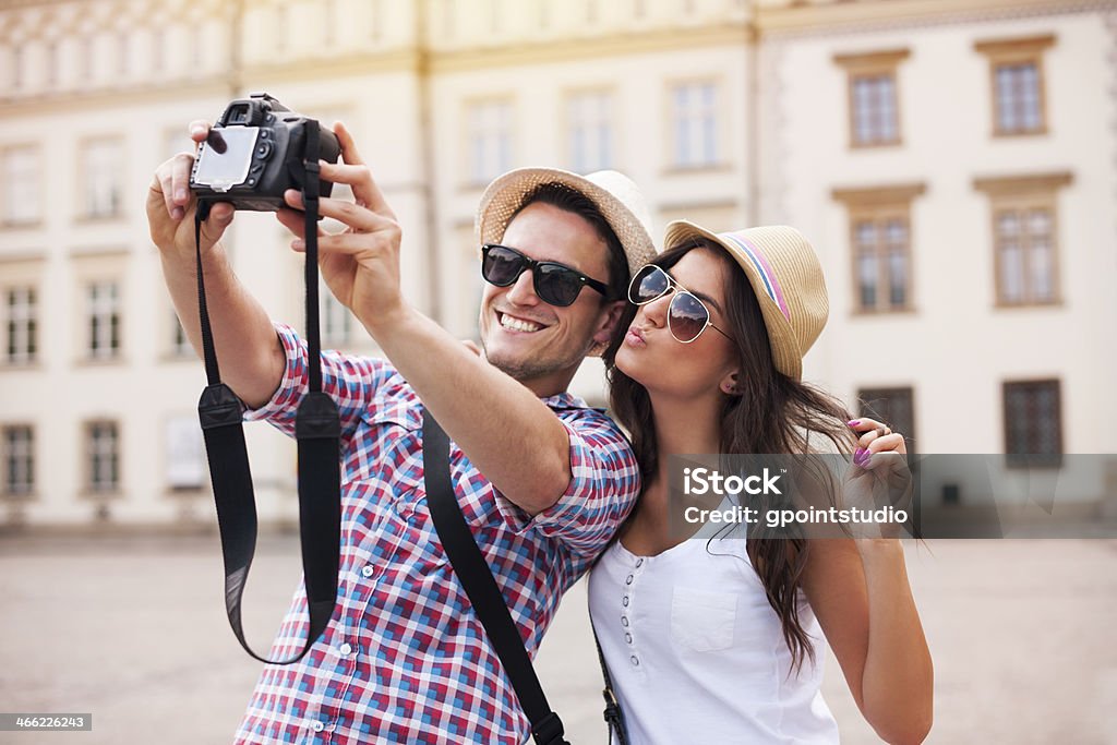 Happy tourists taking photo of themselves Couple - Relationship Stock Photo