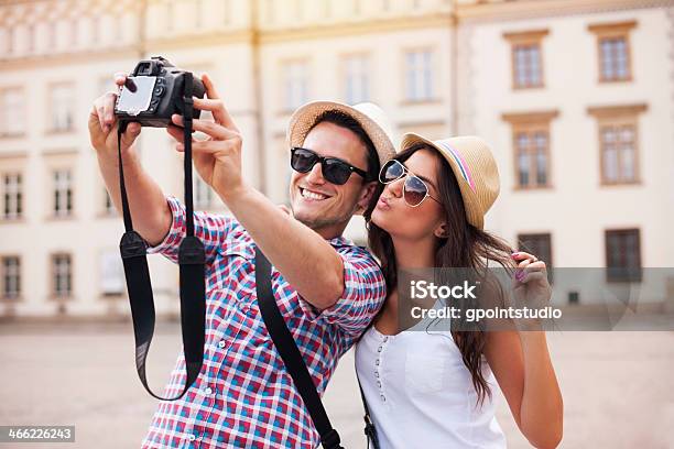 Happy Tourists Taking Photo Of Themselves Stock Photo - Download Image Now - Couple - Relationship, Camera - Photographic Equipment, Tourist