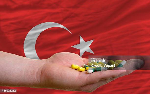 Holding Pills In Hand And Flag Of Turkey Stock Photo - Download Image Now - 2015, Addiction, Adult