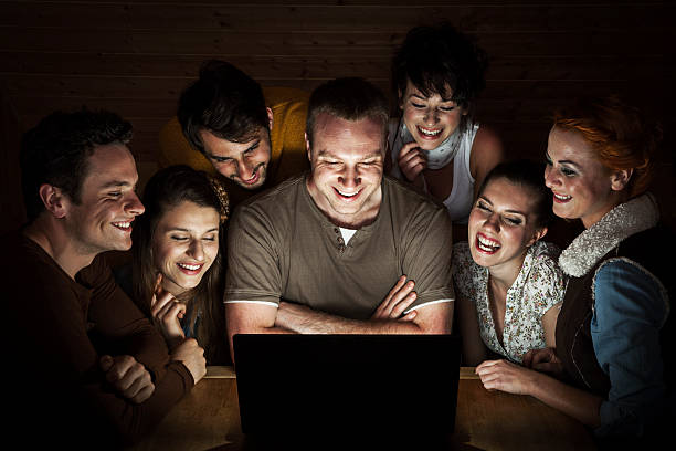istock Group Of Friends At Laptop 466226799