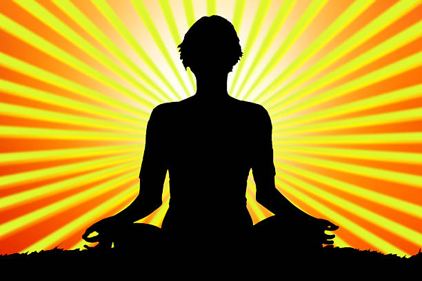 istock meditating woman silhouette 466228238