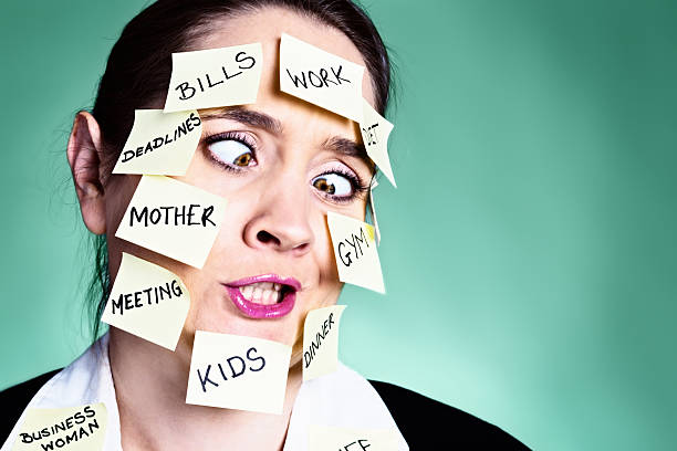 istock Squinting woman covered in  task reminders loses her cool! 466228735