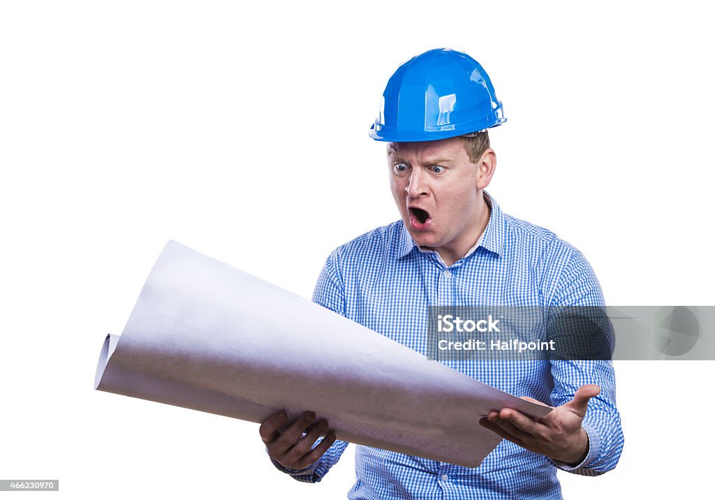 Engineer in blue helmet Engineer in blue hard hat holding a blueprint. Studio shot on white background. 2015 Stock Photo