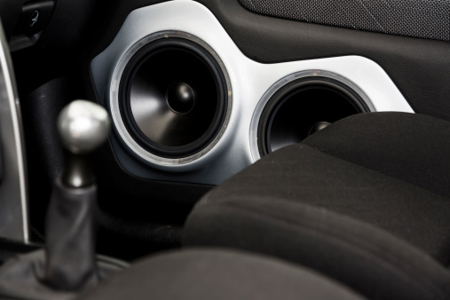 A close up image of a car door speakers.