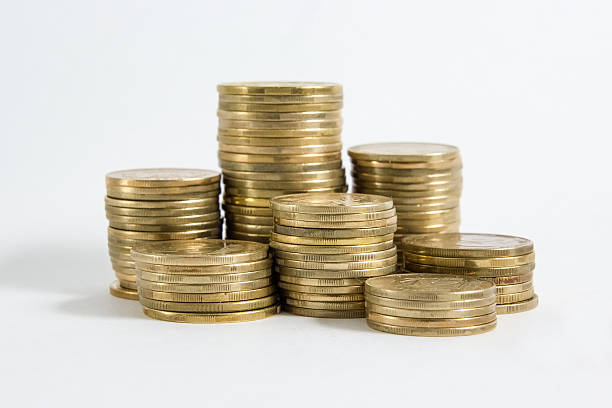 istock Columns of coins isolated on white background 466235138