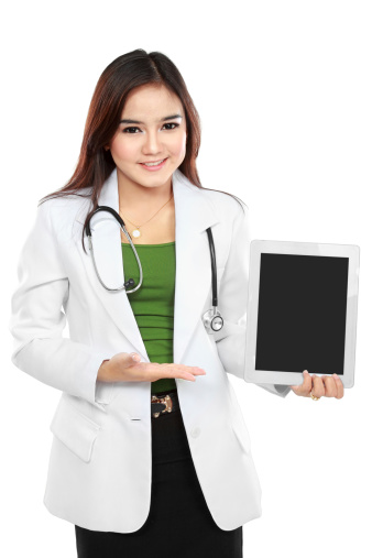 Copy-spaced portrait of female doctor holding a tablet with empty screen isolated on white