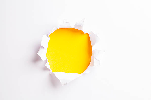 istock White card/paper with torn hole in the middle, colourful background 466239060
