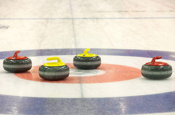 istock Group of curling rocks on ice 466240200