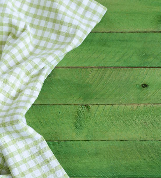 istock Wooden background with green checkered kitchen towel 466240613