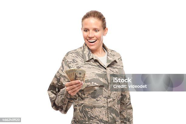 Excited Female Airman With Money Stock Photo - Download Image Now - 2015, 30-34 Years, 30-39 Years