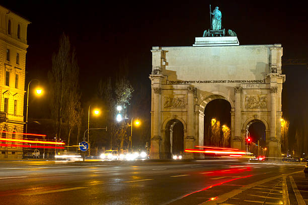 The historic "Siegestor" in Munich, Germany, at night The historic "Siegestor" in Munich, Germany, at night siegestor stock pictures, royalty-free photos & images