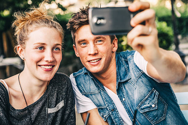 istock Two Friends Taking Pictures Together with a Smartphone 466242691