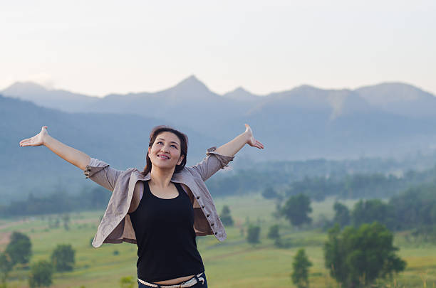 istock Pretty woman with opened arms expressing freedom 466249155