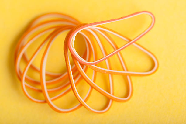istock Pile of Colored Rubber Bands on Color Background 466250980