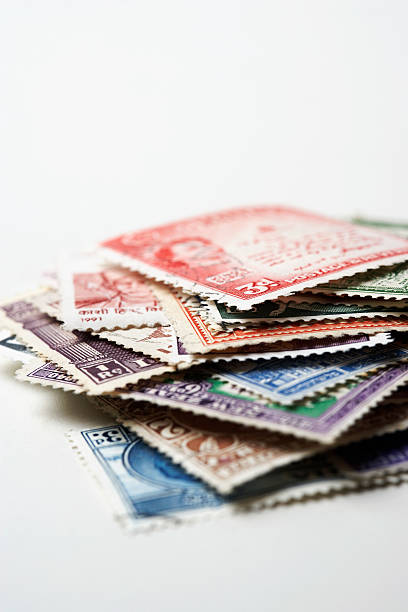 Pile of Postage Stamps Pile of Postage Stamps stamp collecting stock pictures, royalty-free photos & images