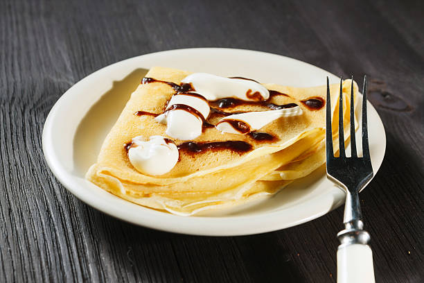 istock Closeup of chocolate pancakes with whipped cream 466251685