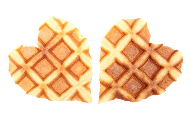 Closeup of heart shaped waffles. Isolated on white background