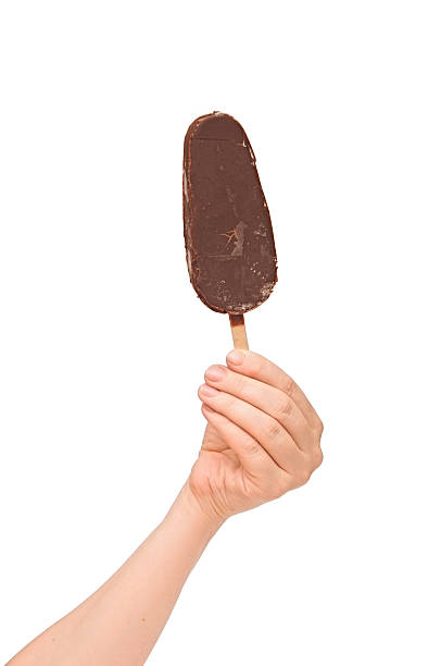 istock One chocolate vanilla ice cream in hand isolated on white 466255673