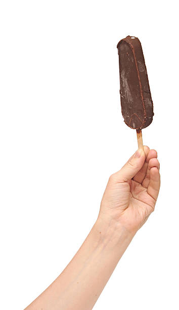 istock One chocolate vanilla ice cream in hand isolated on white 466255809