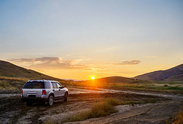 istock Outlander stopped on a dirt road looking at the sunset 466256808