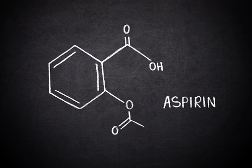 chemical formula of acetylsalicylic acid on a blackboard