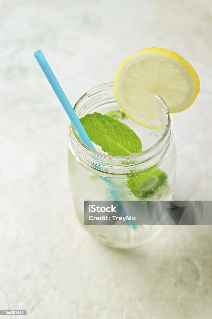 Lemon and Mint Cocktail Soda, mint and lemon cocktail in a mason jar. Airtight Stock Photo