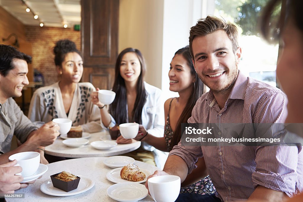 Group Of Friends Meeting In Café Restaurant Happy Smiling Group Of Friends Meeting In Café Restaurant Coffee - Drink Stock Photo