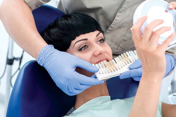 istock The client chooses the color of future crowns on teeth. 466259748