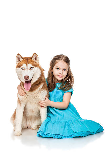istock Girl with a dog husky 466261436