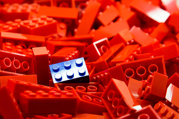 istock Pile of red building blocks with focus on blue block 466261550