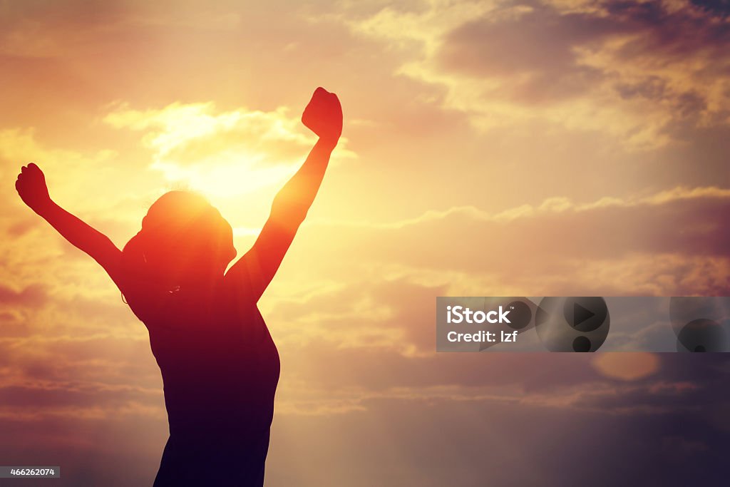 strong confident woman open arms to sunrise at sea strong confident  woman open arms to sunrise at sea Confidence Stock Photo