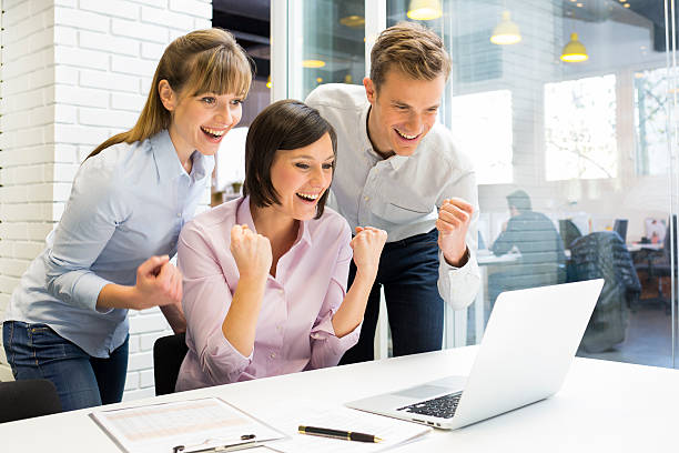 istock Happy Successful  business team in office, with arms up 466263969